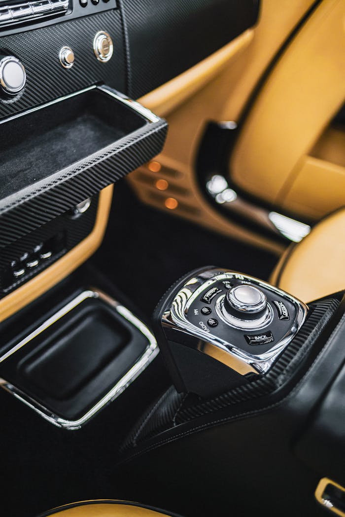 Close-up of a luxury car interior showcasing dashboard and control panel with premium design.